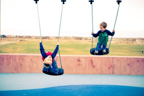 boys swinging